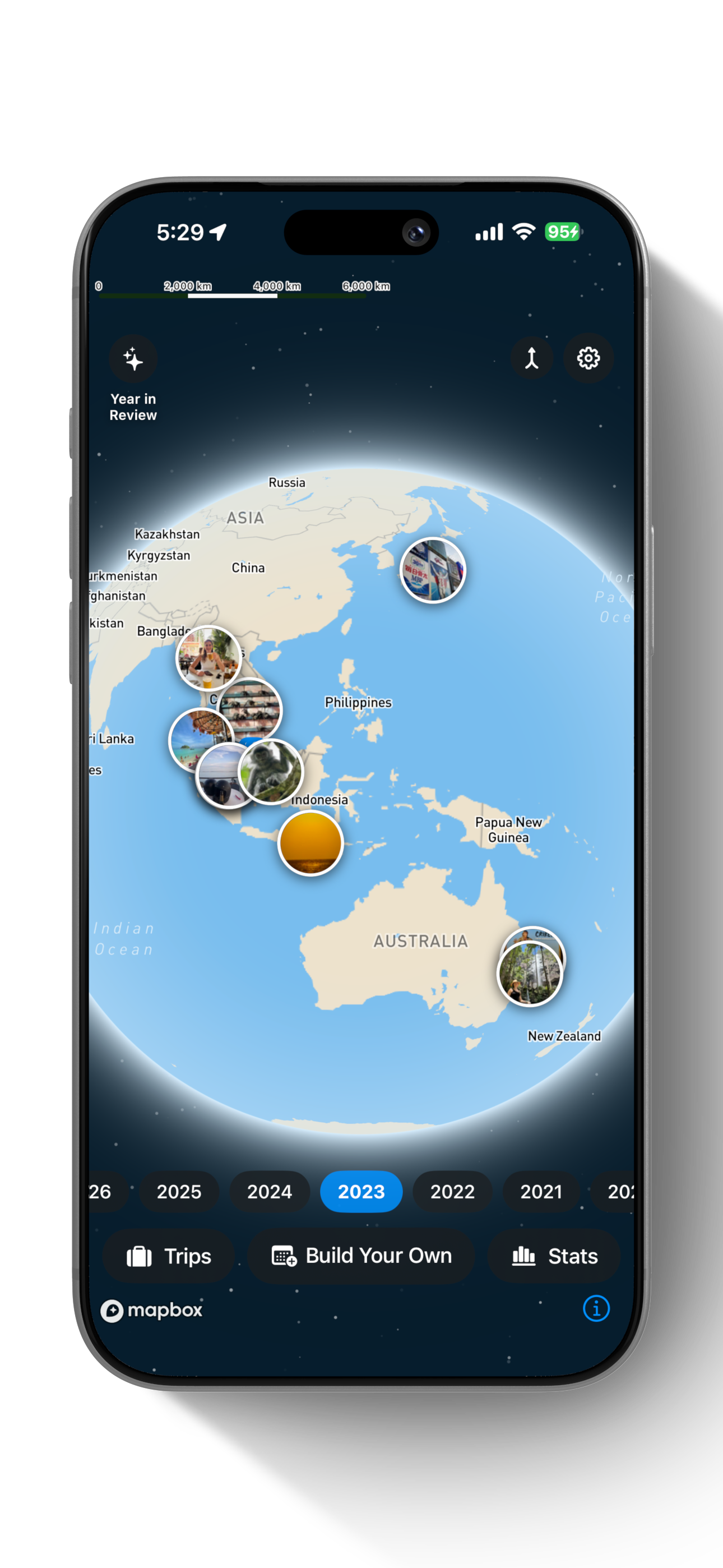 Roamango globe home screen with photo pins
